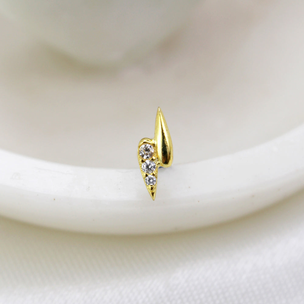 Piercing en forma de rayo con piedras dorado